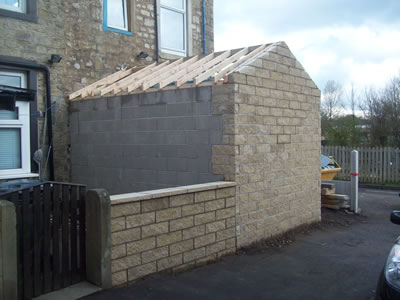 Stone faced storage extension to terraced house